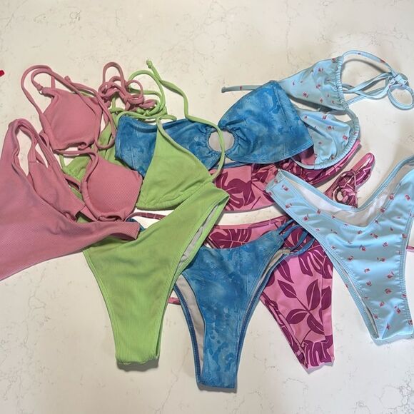 A lot of 5 sets of string bikinis. Tags have all been removed. Sizes are Small - Picture 1 of 6